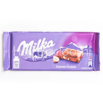 شکلات تخته ای میلکا با مغز فندق و کشمش 100 گرمی